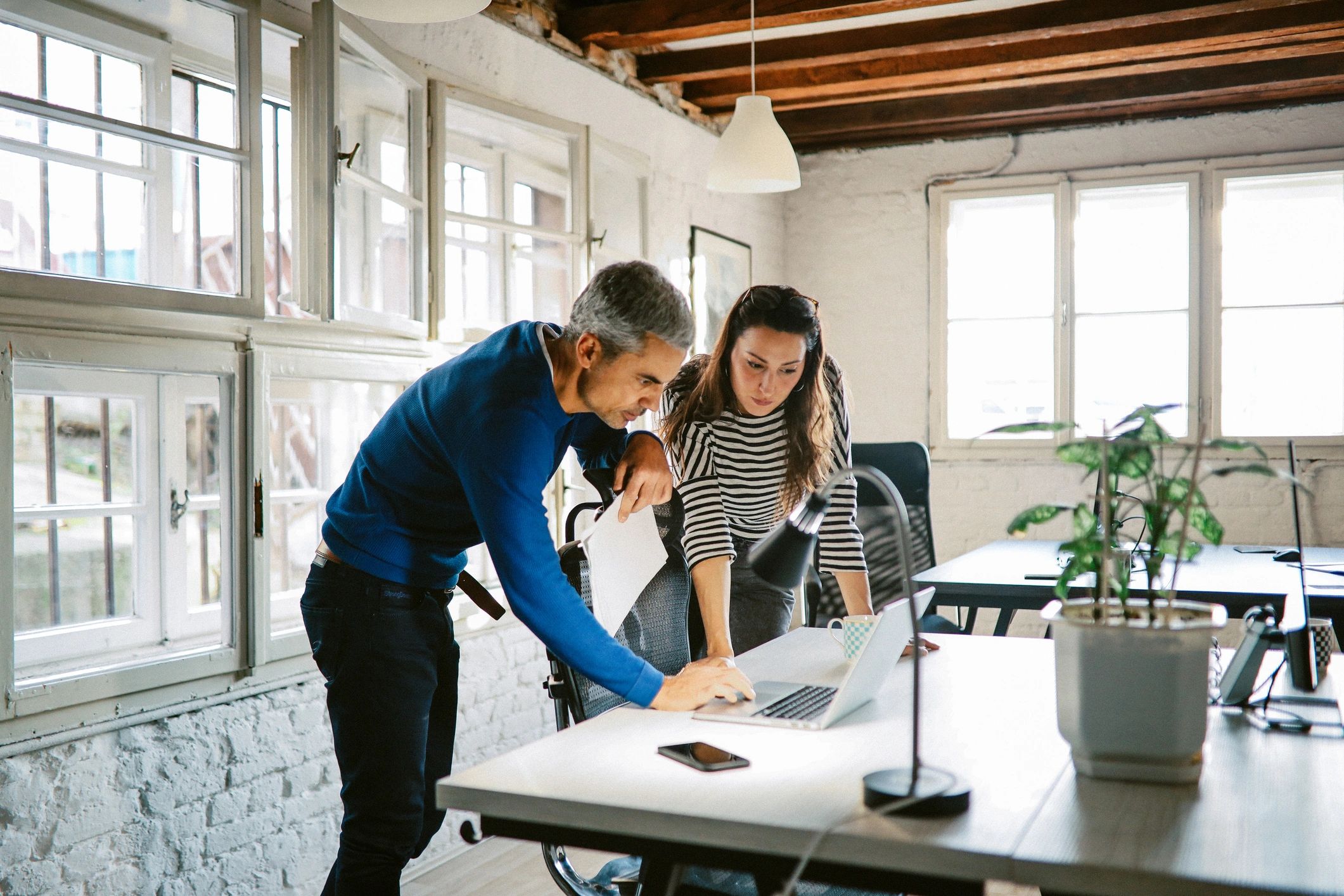 Modern team collaborating in a technology office