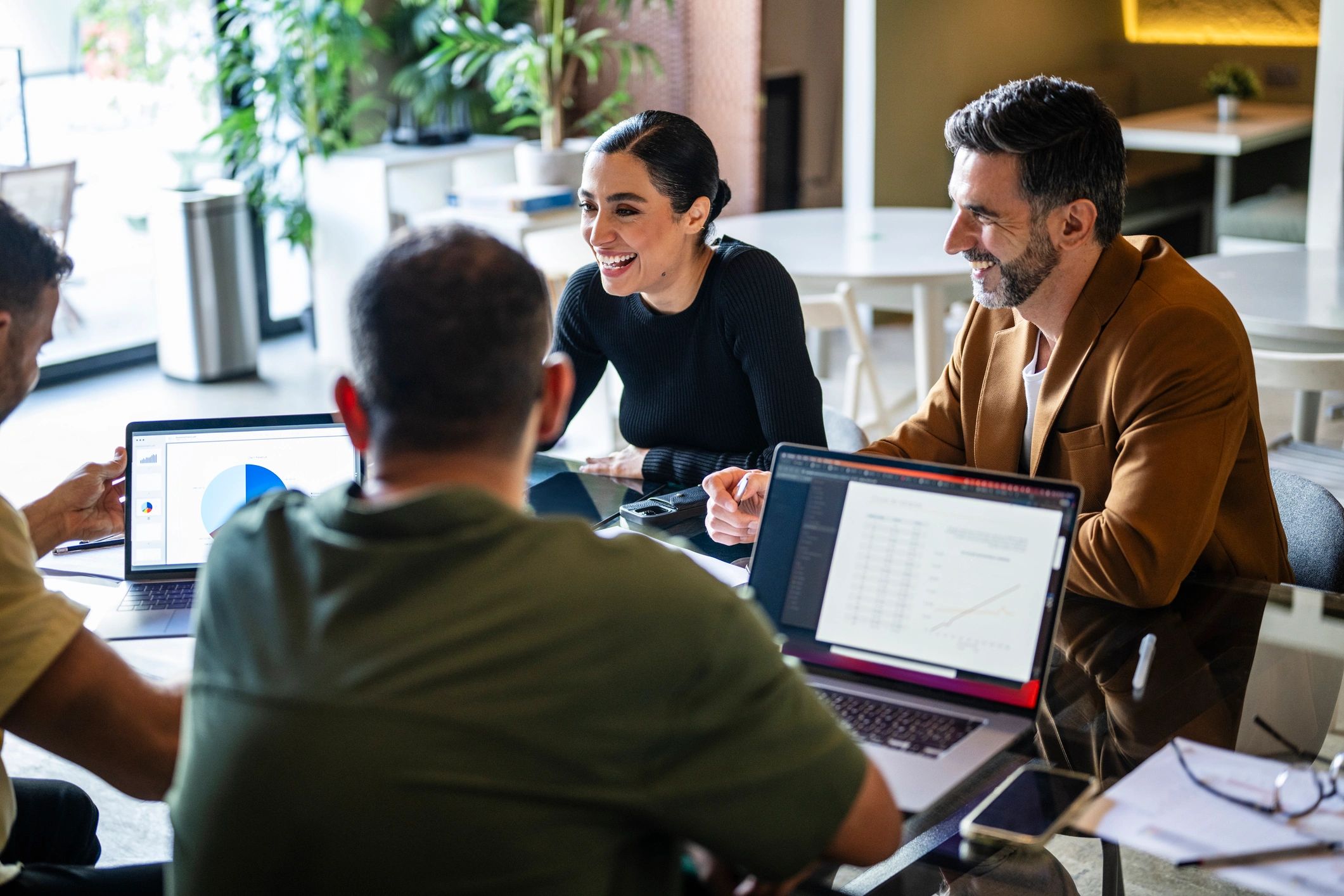 Technology consultants meeting with laptops